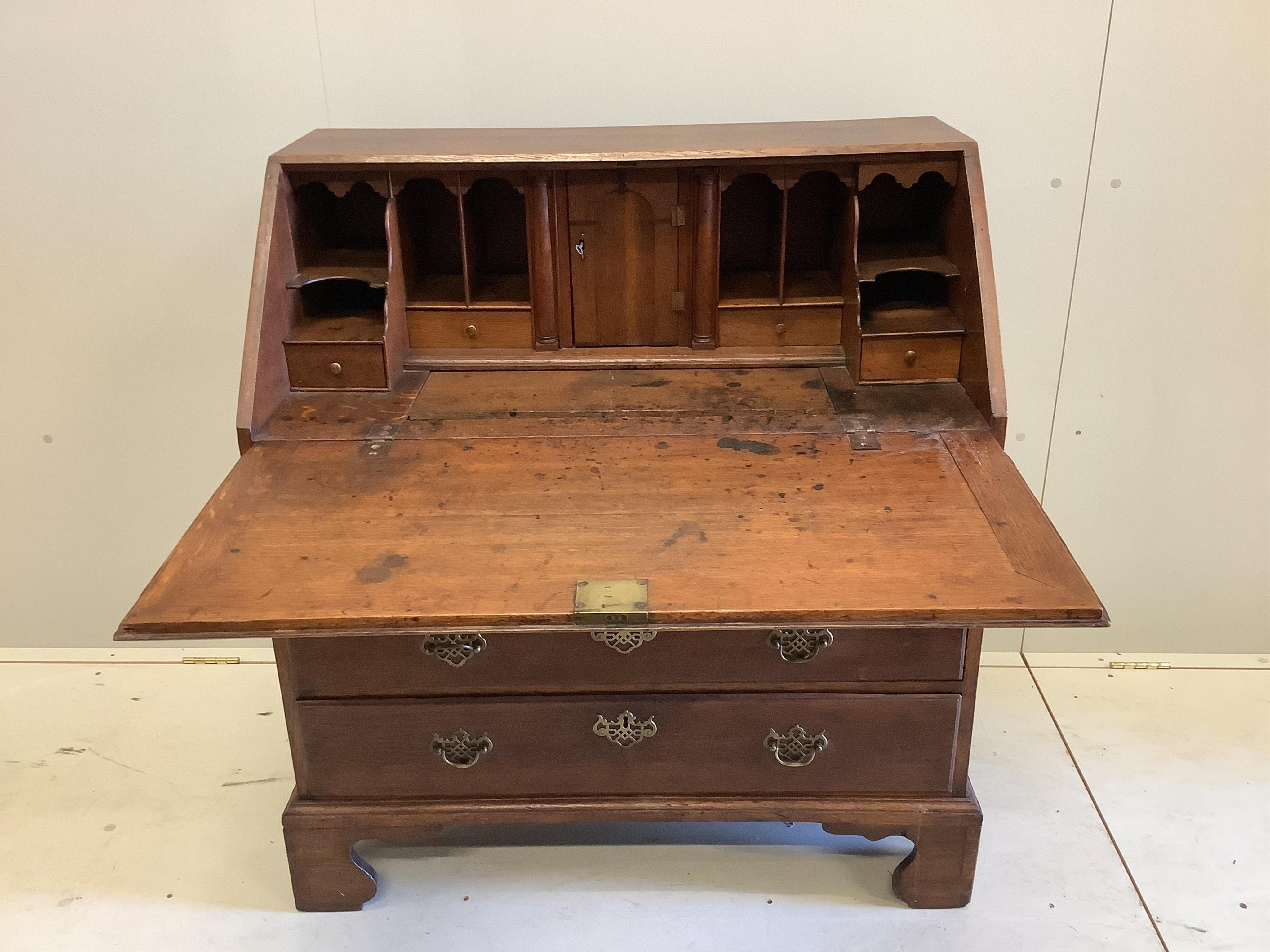 A mid 18th century oak bureau, width 94cm, depth 53cm, height 101cm. Condition - fair